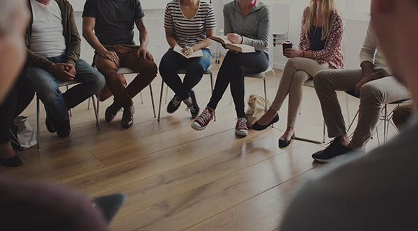 People sitting in a circle counseling